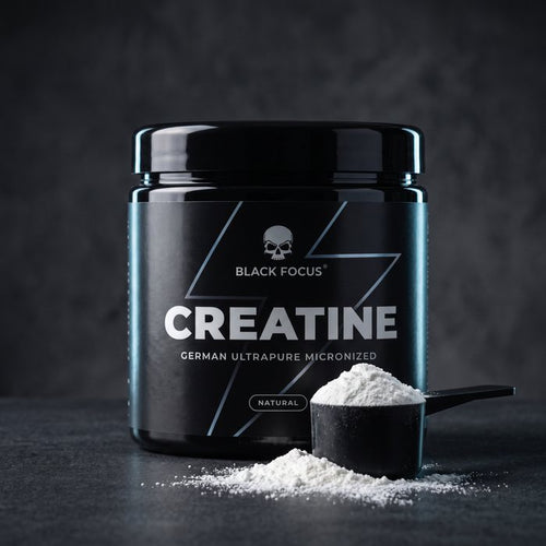 Barattolo di Black Focus Creatine da 250 g con un misurino di polvere